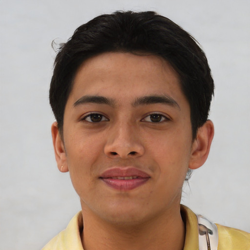 Joyful asian young-adult male with short  brown hair and brown eyes