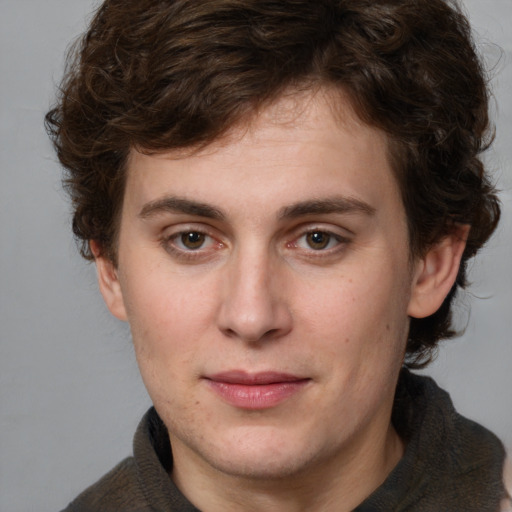 Joyful white young-adult male with medium  brown hair and brown eyes