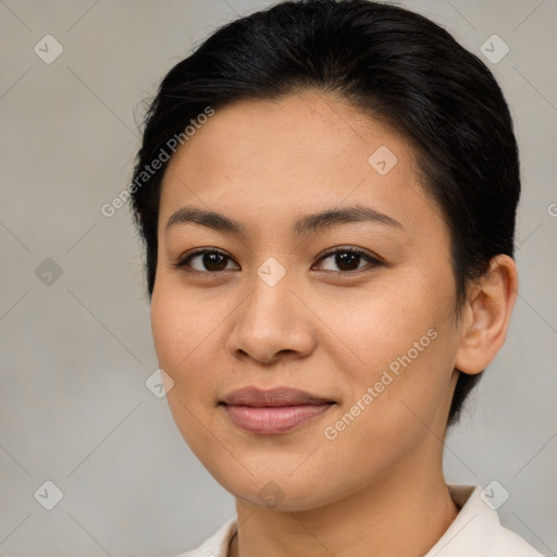 Joyful latino young-adult female with short  brown hair and brown eyes