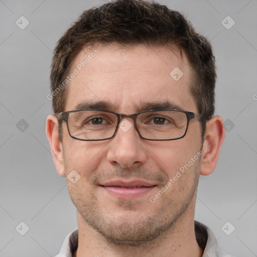 Joyful white adult male with short  brown hair and brown eyes