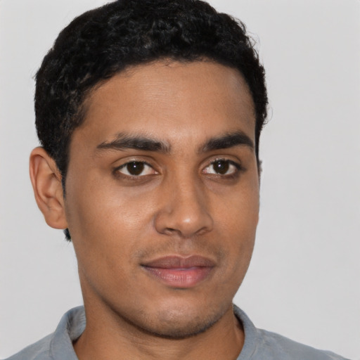 Neutral latino young-adult male with short  brown hair and brown eyes