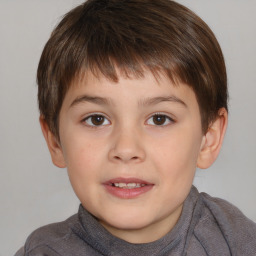 Joyful white child male with short  brown hair and brown eyes