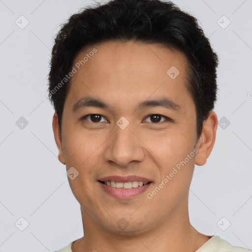 Joyful asian young-adult male with short  brown hair and brown eyes