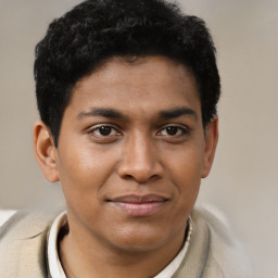 Joyful latino young-adult male with short  brown hair and brown eyes