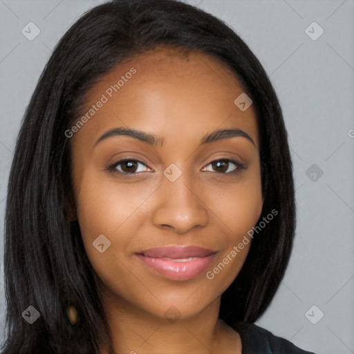 Joyful black young-adult female with long  brown hair and brown eyes