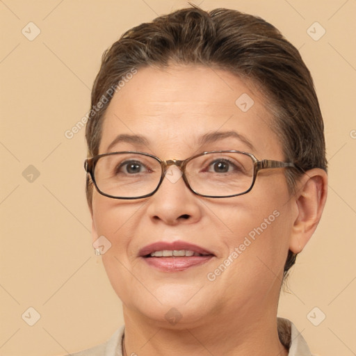 Joyful white adult female with short  brown hair and brown eyes