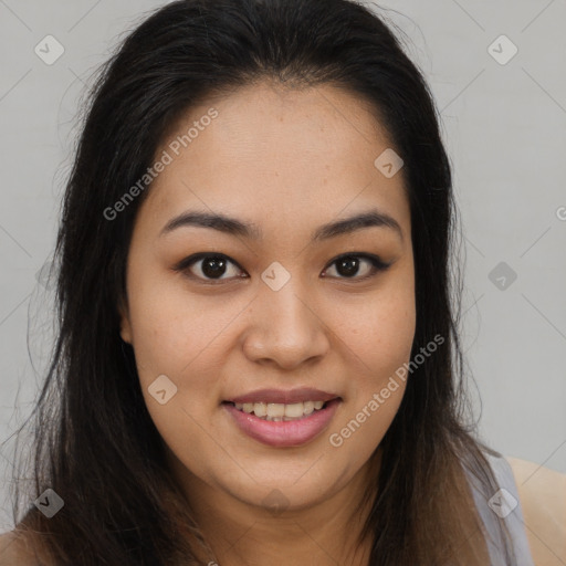 Joyful asian young-adult female with long  brown hair and brown eyes