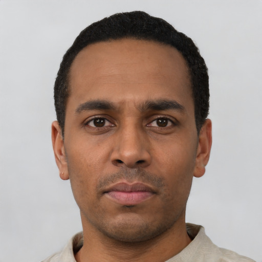 Neutral latino young-adult male with short  black hair and brown eyes
