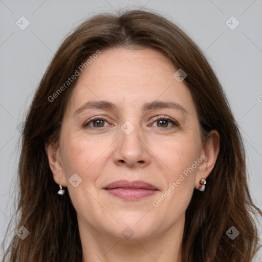 Joyful white adult female with long  brown hair and grey eyes