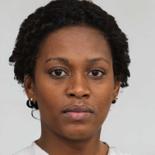Neutral black young-adult female with short  brown hair and brown eyes