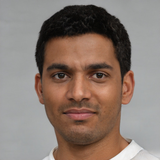 Neutral latino young-adult male with short  black hair and brown eyes