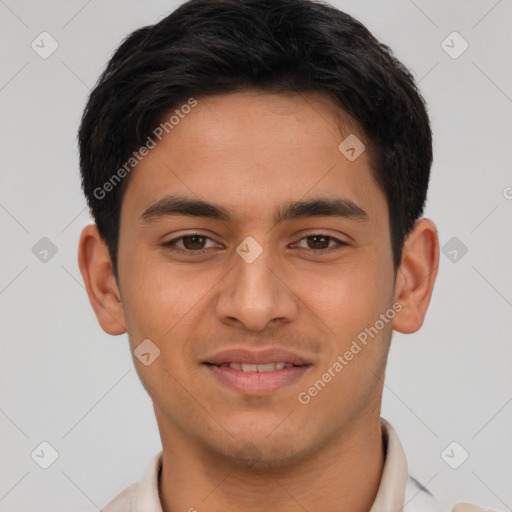 Joyful latino young-adult male with short  brown hair and brown eyes
