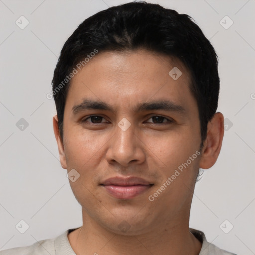 Joyful latino young-adult male with short  black hair and brown eyes