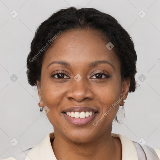 Joyful black young-adult female with short  brown hair and brown eyes