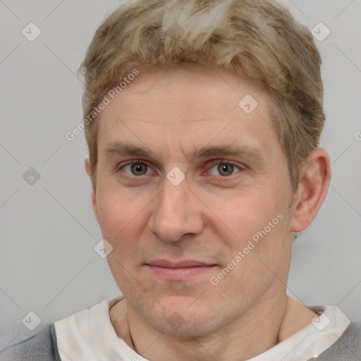 Joyful white adult male with short  brown hair and grey eyes