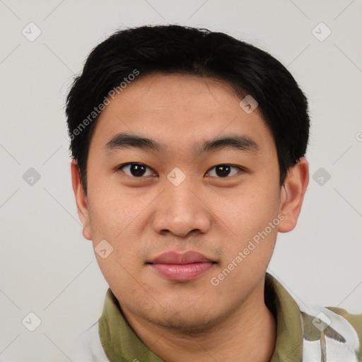 Joyful asian young-adult male with short  black hair and brown eyes