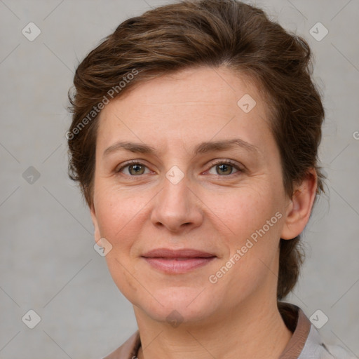 Joyful white adult female with short  brown hair and grey eyes