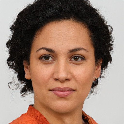 Joyful white adult female with medium  brown hair and brown eyes