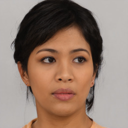 Neutral asian young-adult female with medium  black hair and brown eyes