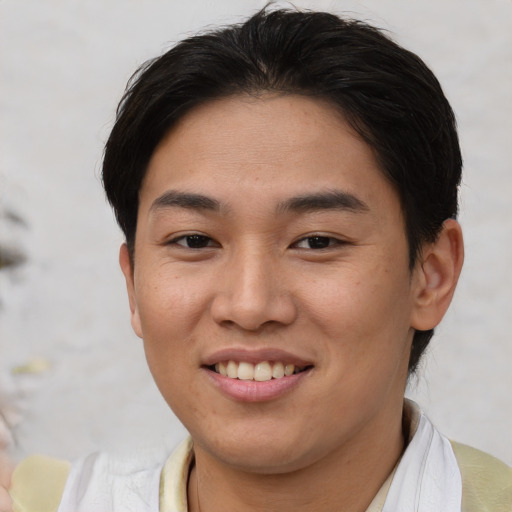 Joyful asian young-adult female with short  brown hair and brown eyes