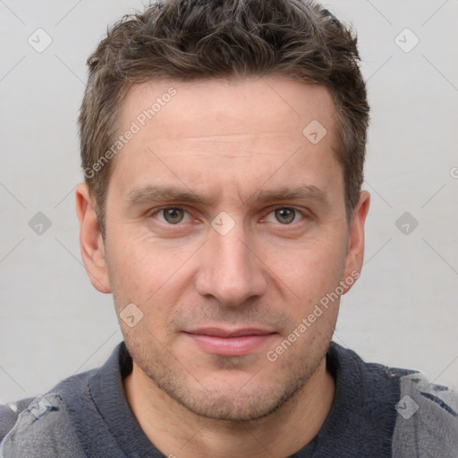 Joyful white adult male with short  brown hair and grey eyes