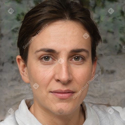 Joyful white adult female with short  brown hair and brown eyes