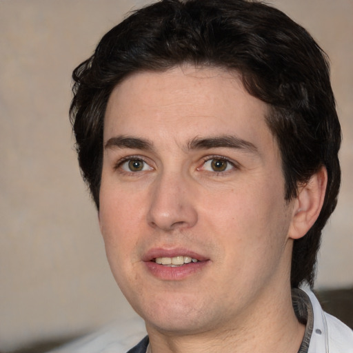 Joyful white young-adult male with short  black hair and brown eyes