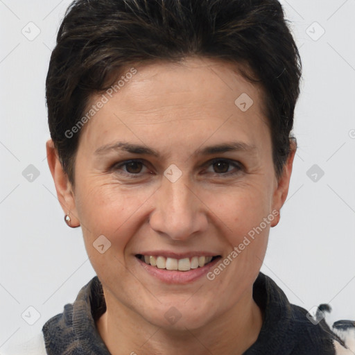 Joyful white adult female with short  brown hair and brown eyes