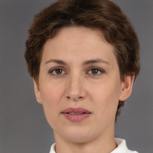 Joyful white adult female with short  brown hair and brown eyes