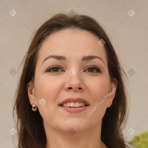 Joyful white adult female with medium  brown hair and brown eyes