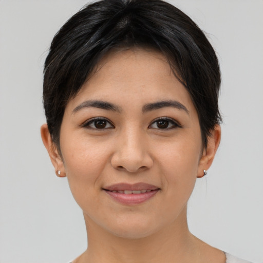 Joyful asian young-adult female with short  brown hair and brown eyes