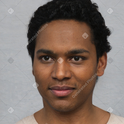 Joyful black young-adult male with short  black hair and brown eyes