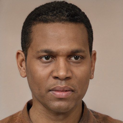 Neutral black young-adult male with short  black hair and brown eyes