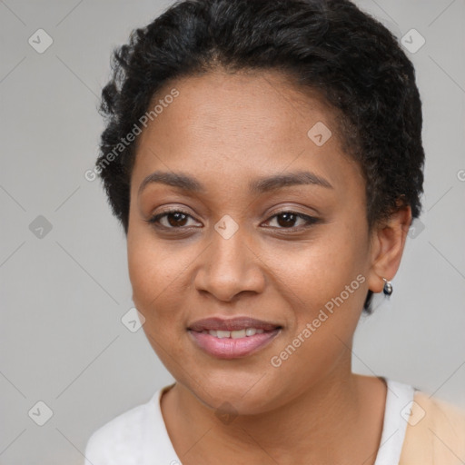 Joyful black young-adult female with short  brown hair and brown eyes