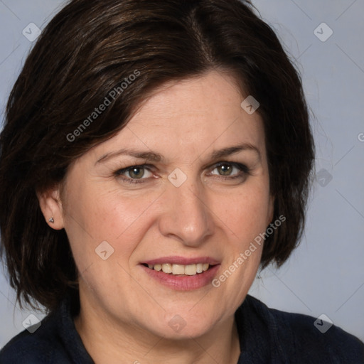 Joyful white adult female with medium  brown hair and brown eyes