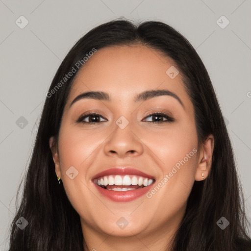 Joyful white young-adult female with long  black hair and brown eyes