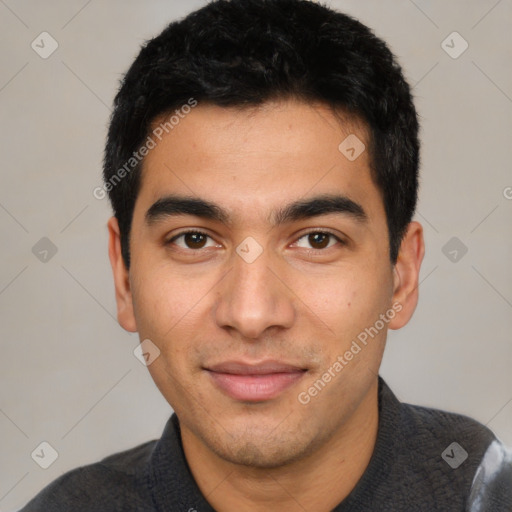 Joyful latino young-adult male with short  black hair and brown eyes