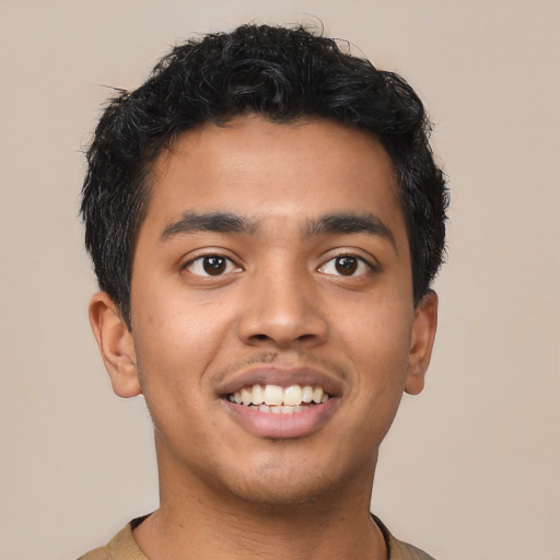 Joyful latino young-adult male with short  black hair and brown eyes