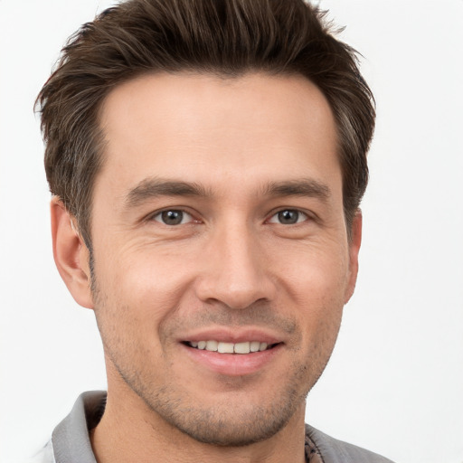 Joyful white young-adult male with short  brown hair and brown eyes