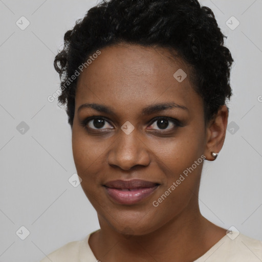 Joyful black young-adult female with short  black hair and brown eyes