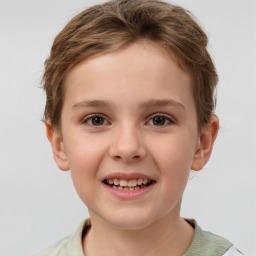 Joyful white child female with short  brown hair and brown eyes