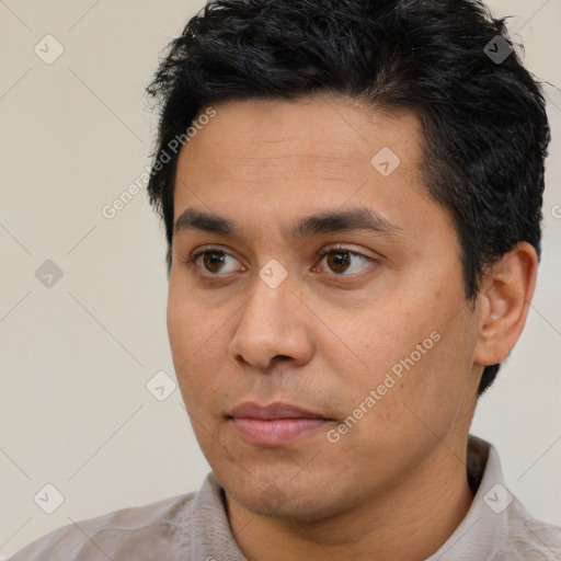 Neutral latino young-adult male with short  black hair and brown eyes