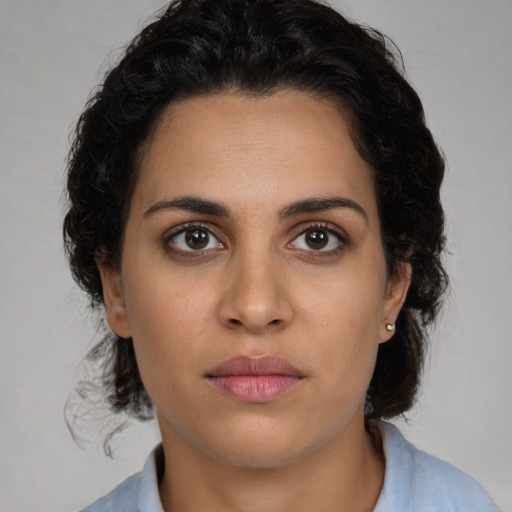Neutral latino young-adult female with medium  black hair and brown eyes
