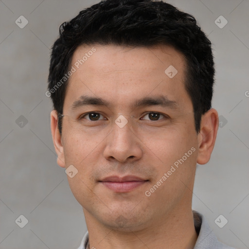 Joyful white young-adult male with short  black hair and brown eyes