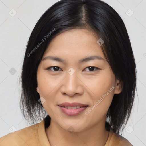 Joyful asian young-adult female with medium  black hair and brown eyes