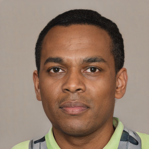 Neutral black young-adult male with short  black hair and brown eyes