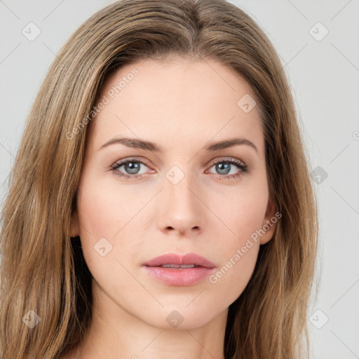 Neutral white young-adult female with long  brown hair and green eyes