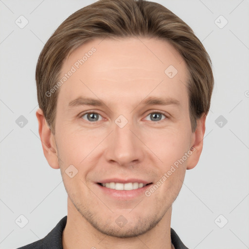 Joyful white young-adult male with short  brown hair and grey eyes