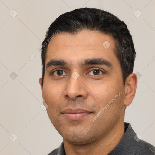 Neutral white young-adult male with short  black hair and brown eyes