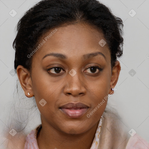 Joyful black adult female with medium  brown hair and brown eyes